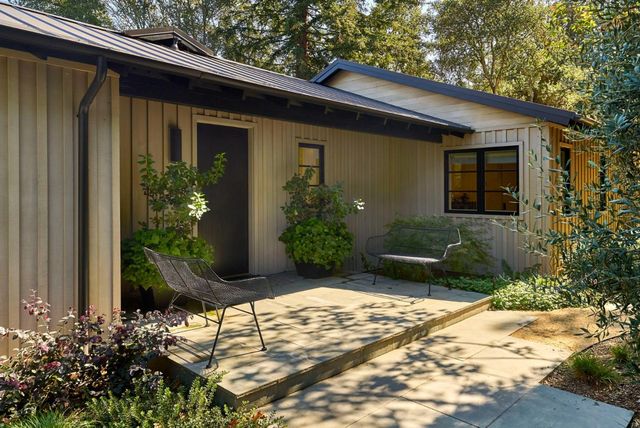 a front view of a house with garden