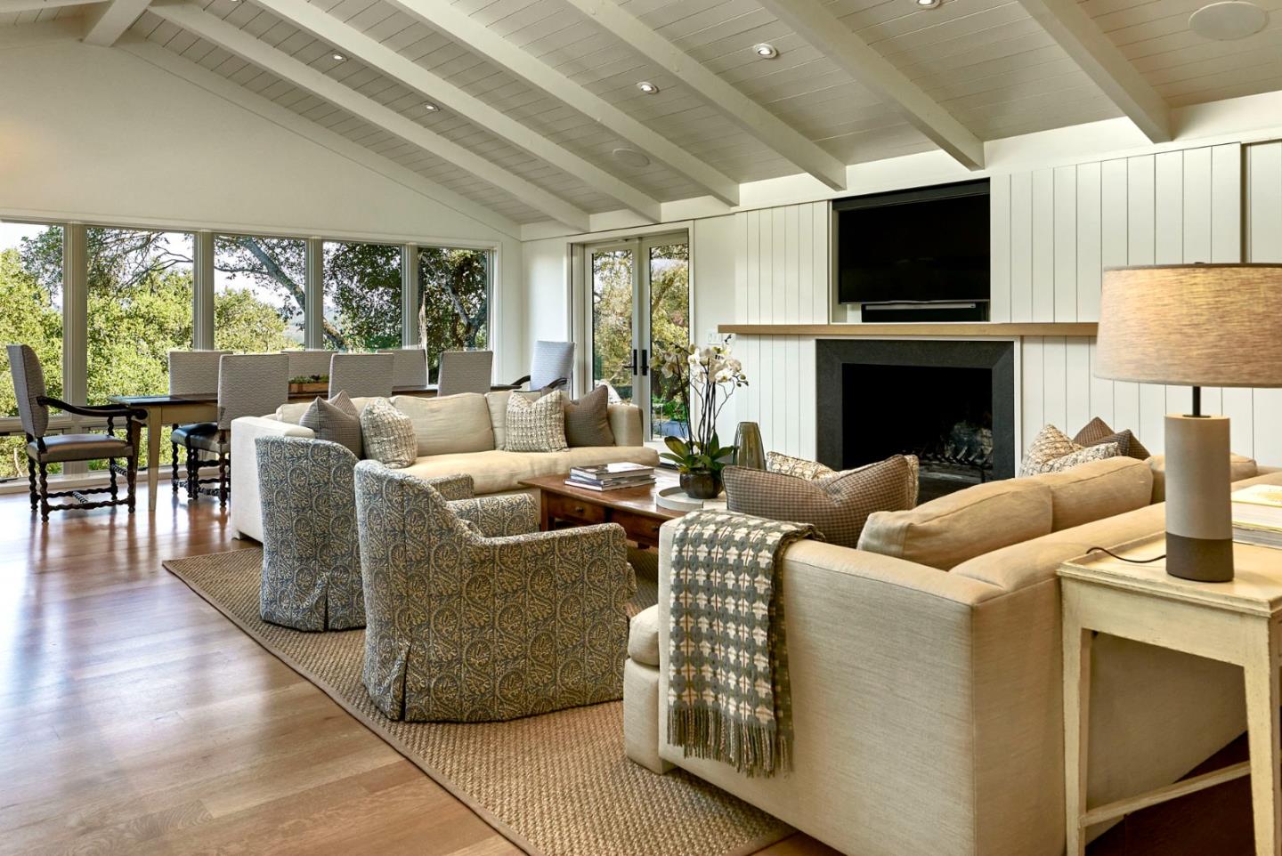2091 Portola Road Woodside, CA 94062 - Photo 4 of 37 a living room with fireplace furniture and a flat screen tv