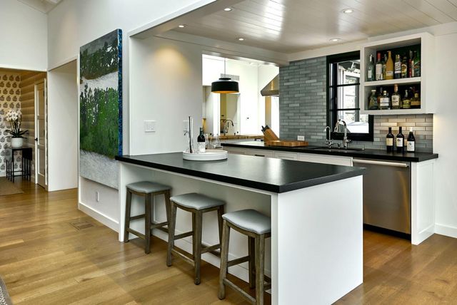 a kitchen with a sink cabinets and window