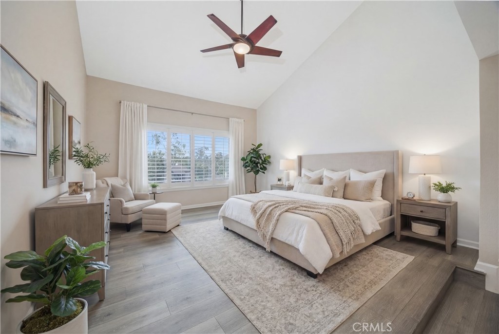 3 Palos, Unit 51 Irvine, CA 92612 - Photo 14 of 40 The spacious and bright primary bedroom with virtual staging. The view outside the oversized-window is gorgeous and pravite. Again, brand-new luxury flooring.