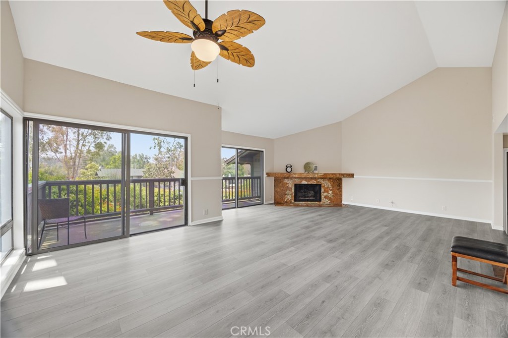 3 Palos, Unit 51 Irvine, CA 92612 - Photo 37 of 40 Another view of the dining room, living room with brand-new ceiling fan/light for the dining room. Brand-new luxury floor.