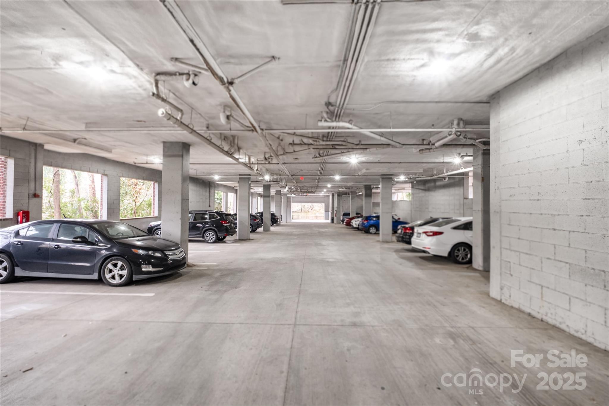 1000 East Woodlawn Road, Unit 217 Charlotte, NC 28209 - Photo 18 of 19 a car parked in a parking space