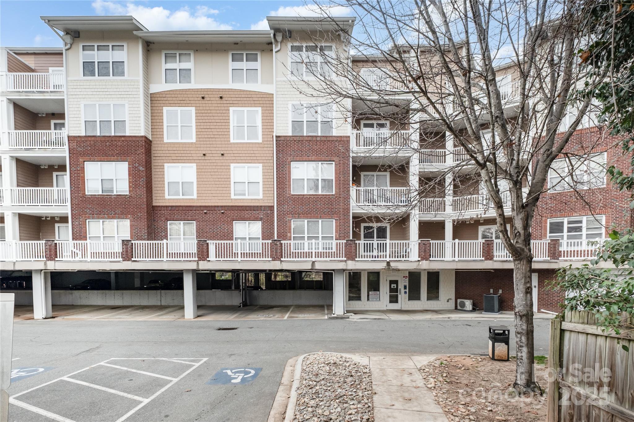 1000 East Woodlawn Road, Unit 217 Charlotte, NC 28209 - Photo 2 of 19 a front view of a building with balcony