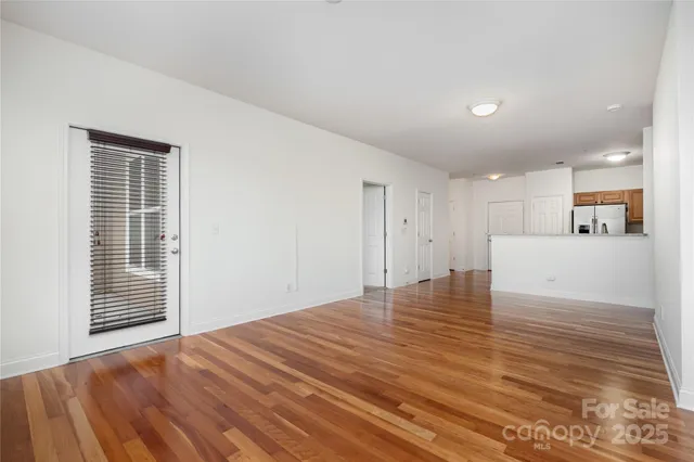 a view of a livingroom with wooden floor