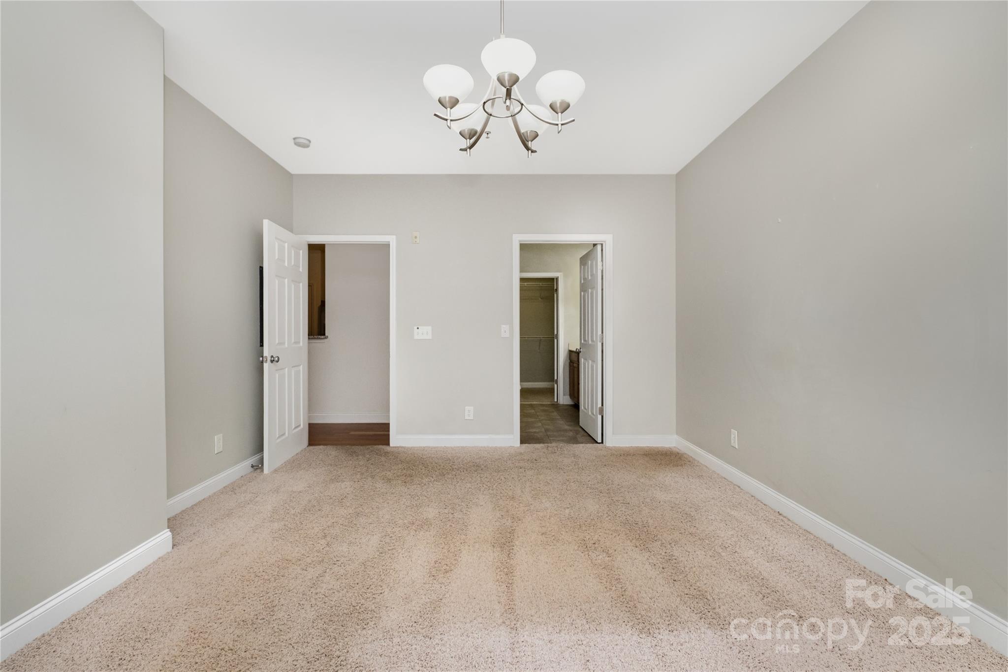 1000 East Woodlawn Road, Unit 217 Charlotte, NC 28209 - Photo 9 of 19 a view of an empty room with a window