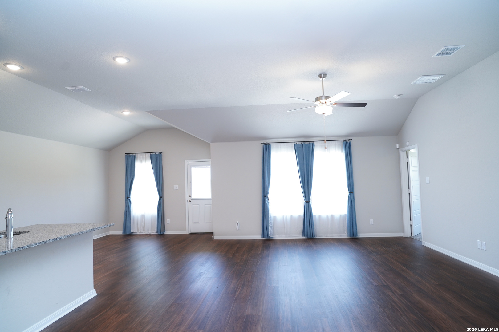 20929 Pleasanton Road San Antonio, TX 78264 - Photo 11 of 51 an empty room with wooden floor and windows