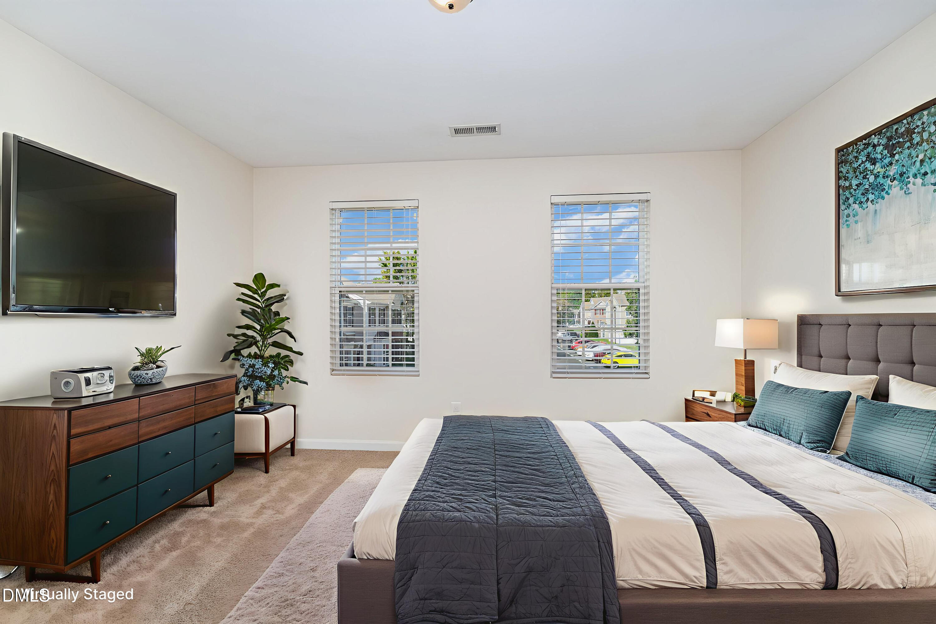 728 Cupola Drive Raleigh, NC 27603 - Photo 14 of 23 a bedroom with a bed and a flat screen tv