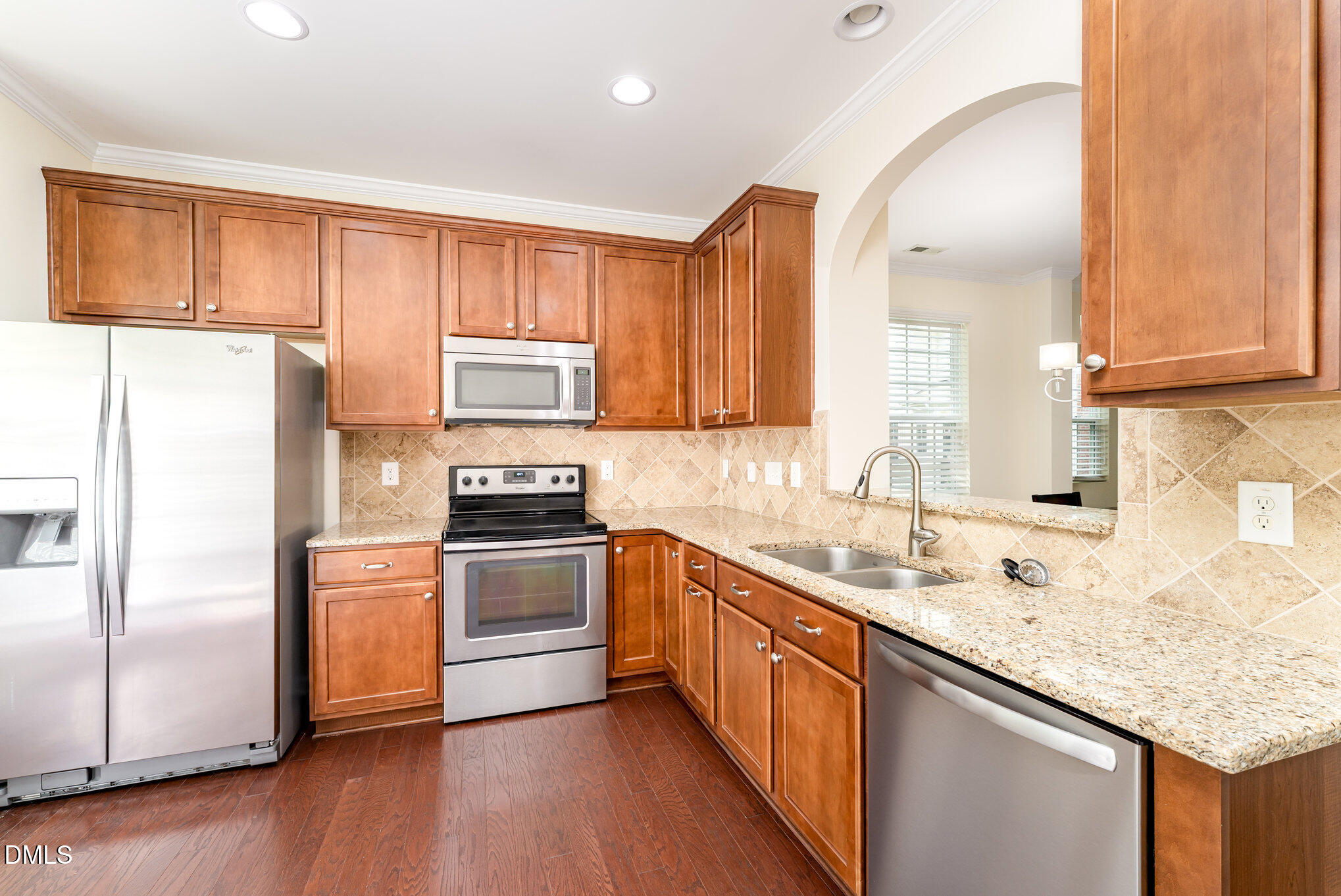728 Cupola Drive Raleigh, NC 27603 - Photo 3 of 23 a kitchen with stainless steel appliances granite countertop a sink stove and refrigerator