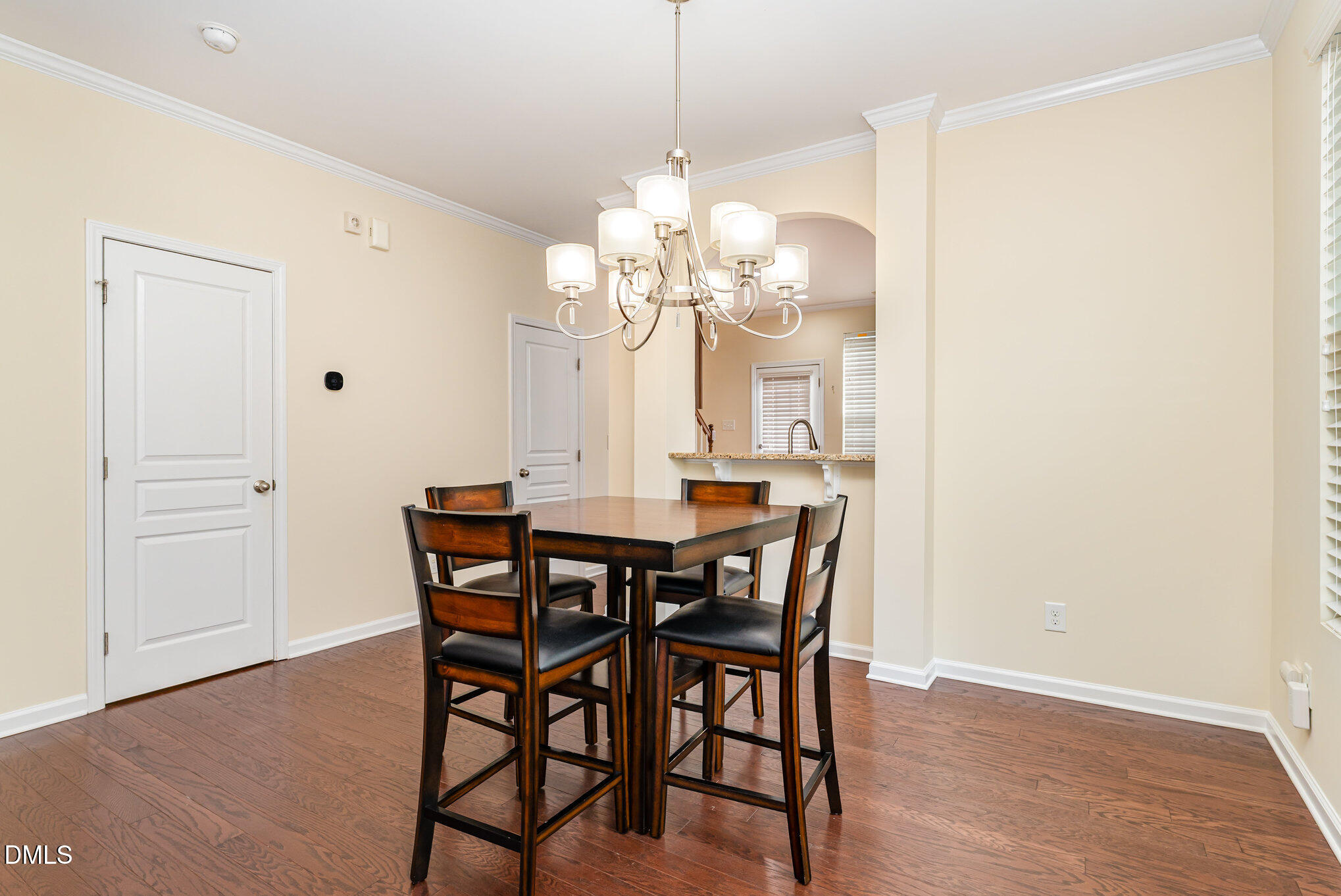 728 Cupola Drive Raleigh, NC 27603 - Photo 4 of 23 a view of a dining room with furniture and wooden floor
