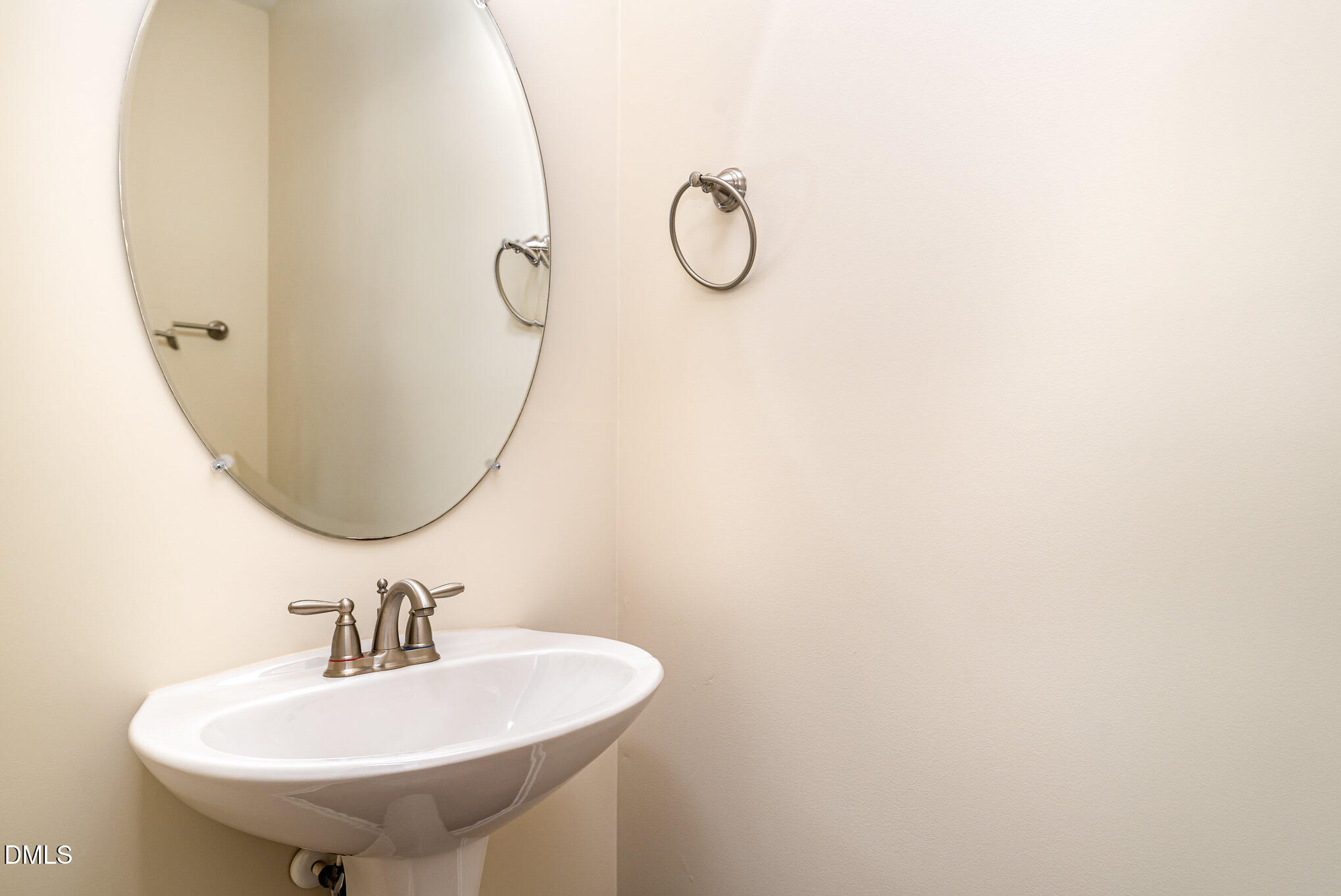 728 Cupola Drive Raleigh, NC 27603 - Photo 7 of 23 a bathroom with a sink and a mirror