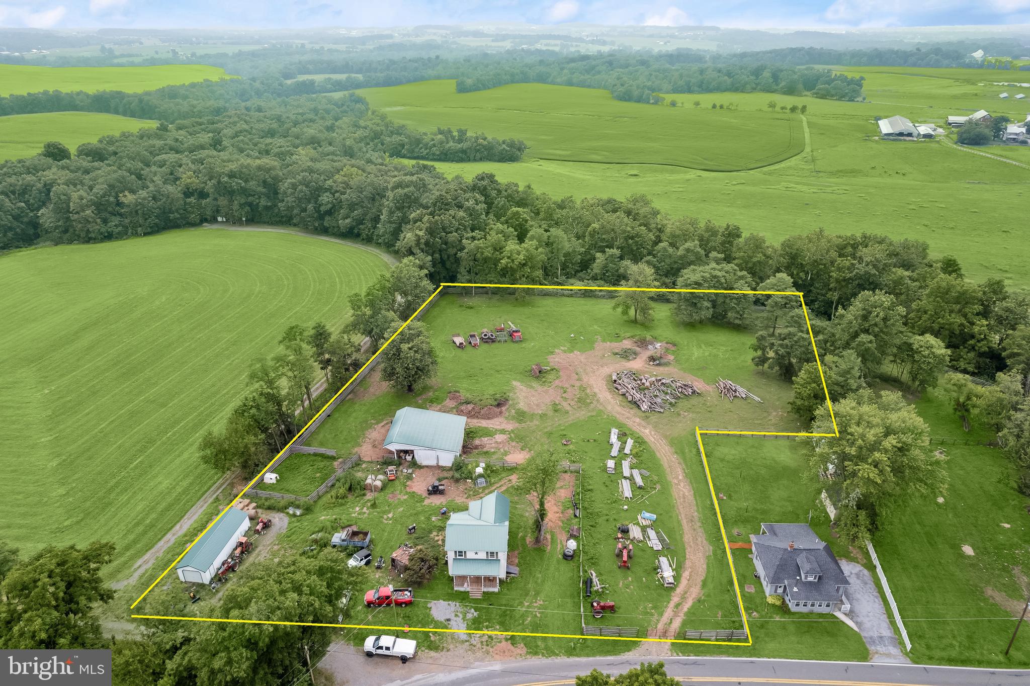an aerial view of a houses with outdoor space and a lake view