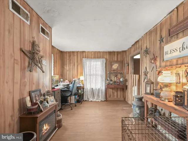 a living room with furniture and large windows