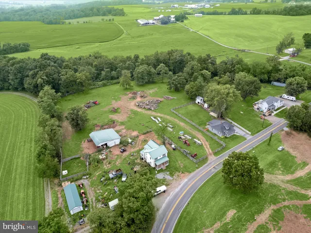 an aerial view of a golf course with a lake view