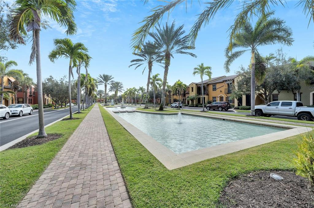 9154 Chula Vista Street, Unit 1331 Naples, FL 34113 - Photo 20 of 25 a view of swimming pool with palm trees