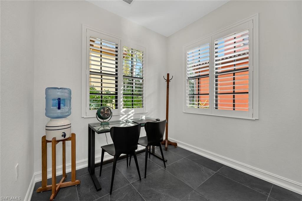 9154 Chula Vista Street, Unit 1331 Naples, FL 34113 - Photo 8 of 25 a view of a workspace with furniture and a window