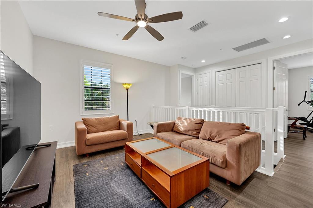 9154 Chula Vista Street, Unit 1331 Naples, FL 34113 - Photo 9 of 25 a living room with furniture and a window