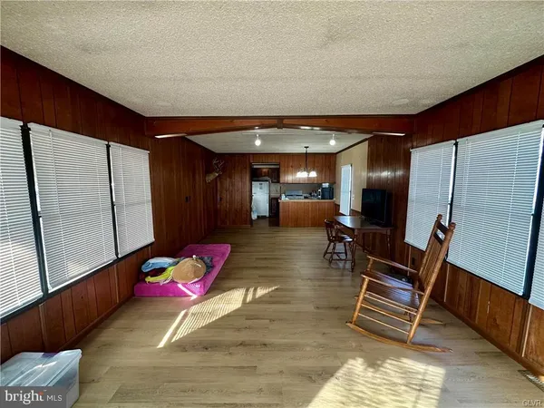 a room with furniture and wooden floor
