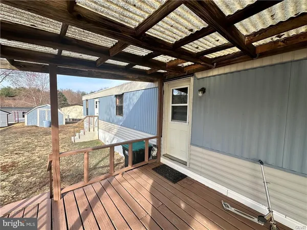a view of a balcony with wooden floor