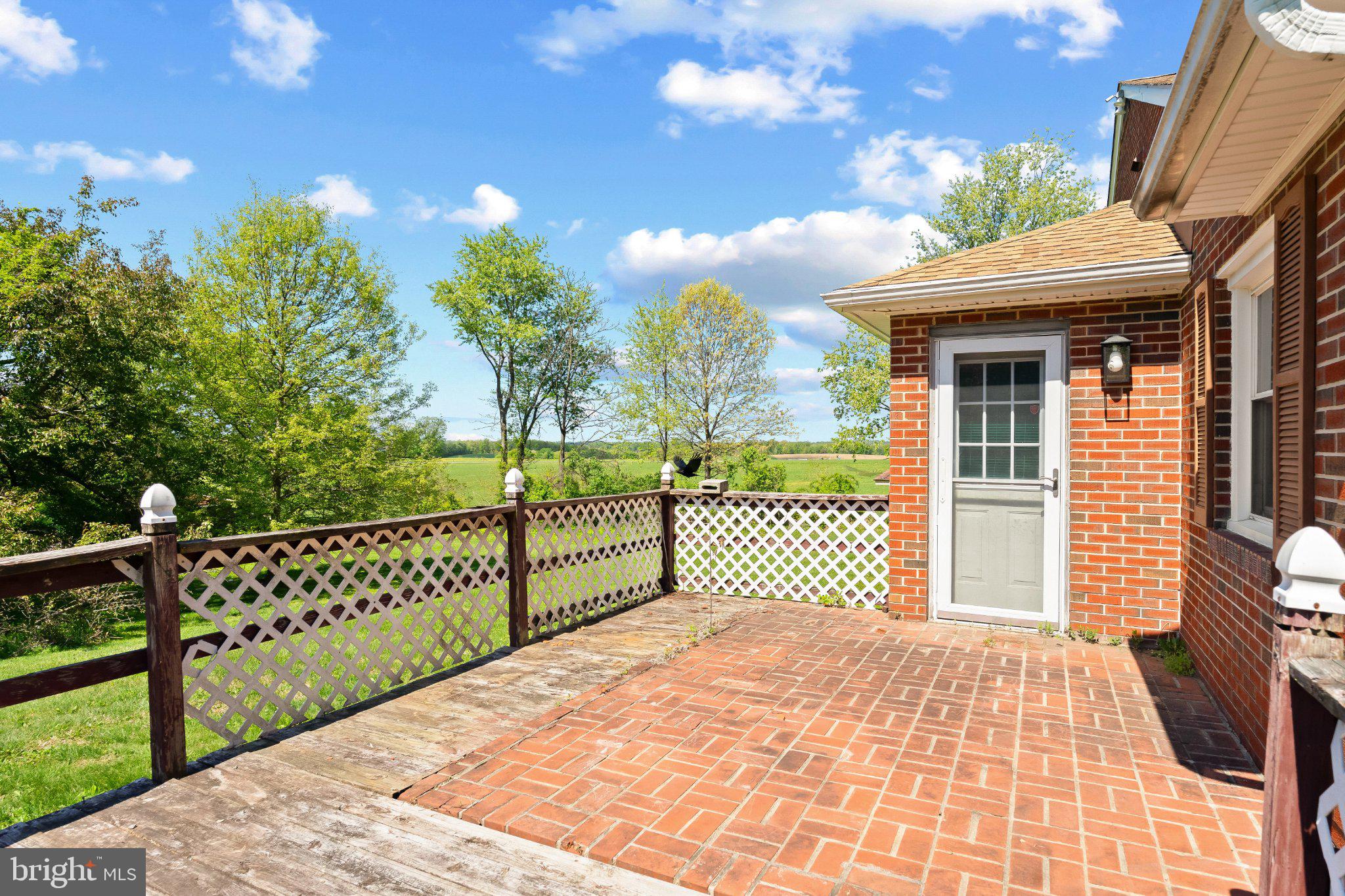 5422 Woodbine Road Woodbine, MD 21797 - Photo 37 of 39 Sunny patio with scenic views.