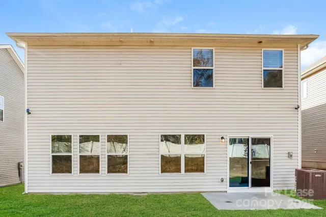 a view of a house with a yard and sitting space