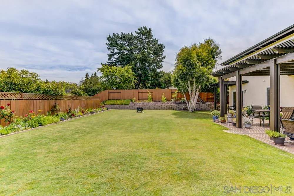 433 Village Run East Encinitas, CA 92024 - Photo 19 of 25 a backyard of a house with table and chairs