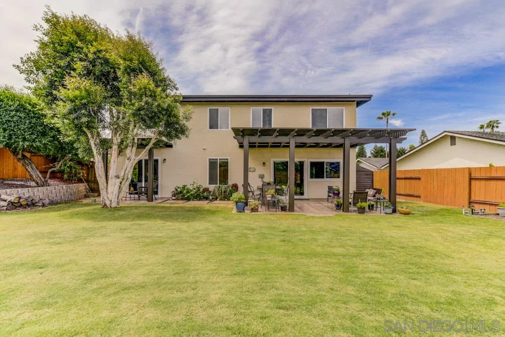 433 Village Run East Encinitas, CA 92024 - Photo 20 of 25 a front view of a house with swimming pool and porch with furniture