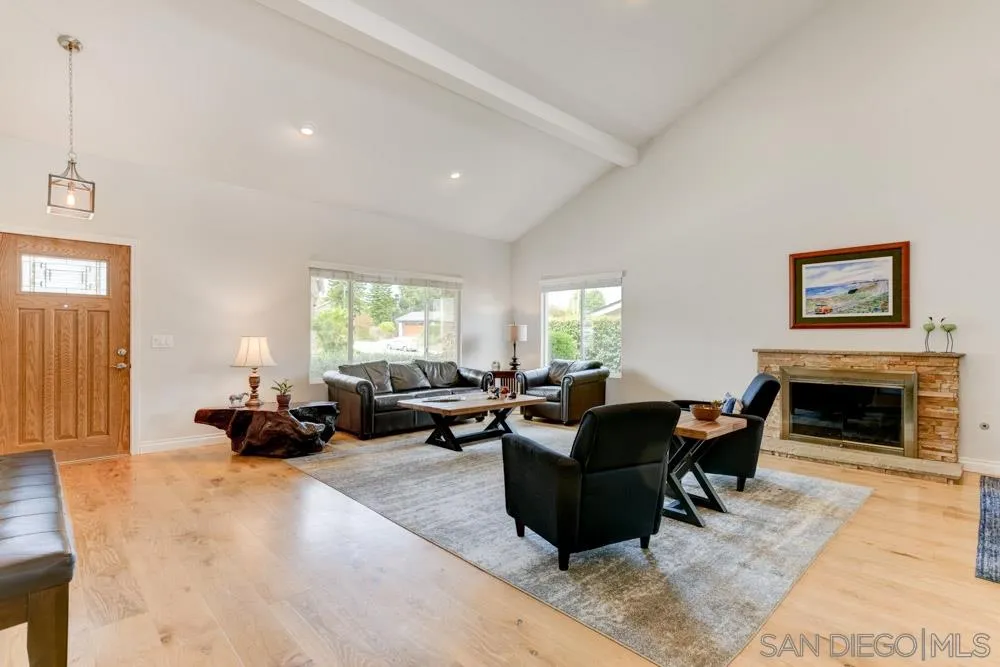 433 Village Run East Encinitas, CA 92024 - Photo 5 of 25 a living room with furniture window and a fireplace
