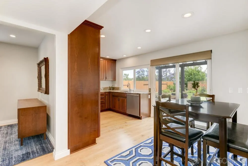 433 Village Run East Encinitas, CA 92024 - Photo 7 of 25 a view of a dining room with furniture and wooden floor