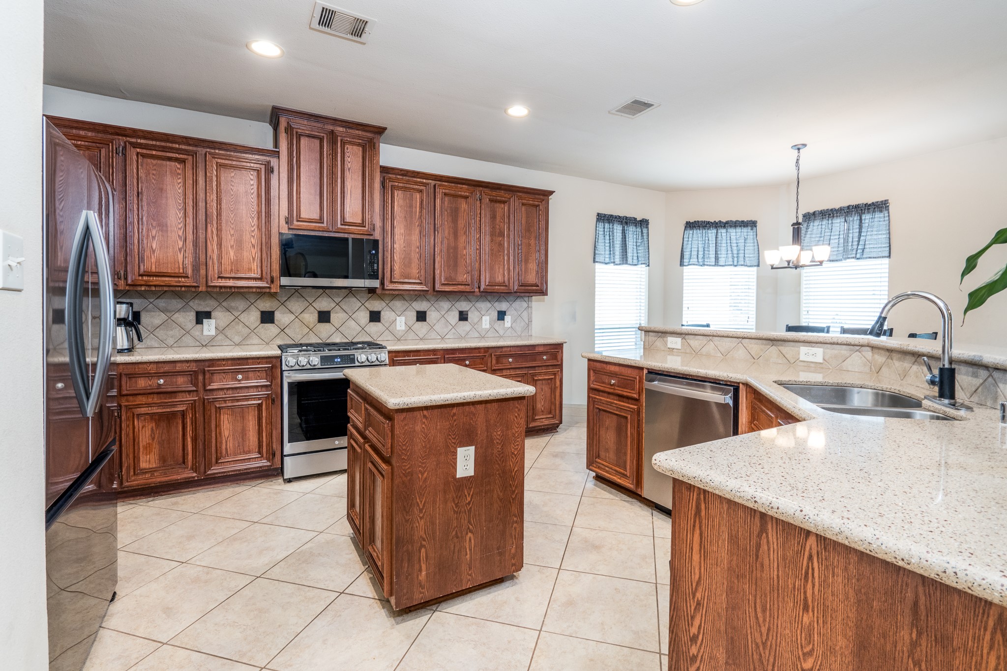 907 Colorado Springs Court Spring, TX 77373 - Photo 7 of 34 Check out this great kitchen with all the beautiful cabinets.