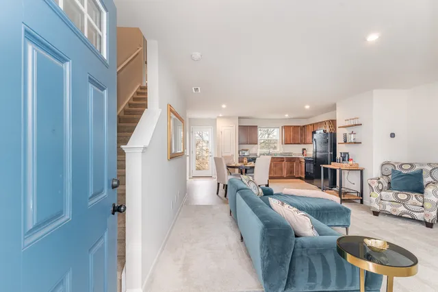 a living room with furniture and a table