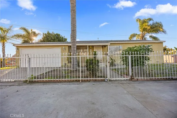 a view of a house with a fence