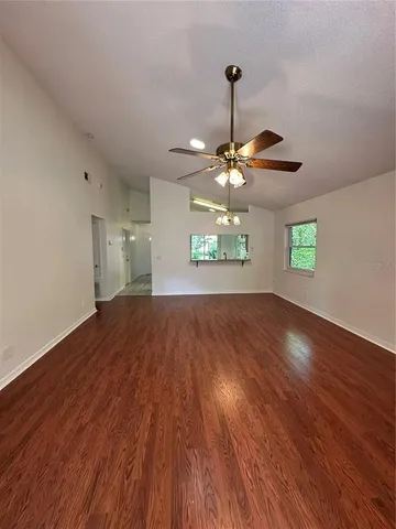 a view of a room with a wooden floor