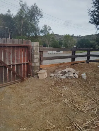 a view of outdoor space with deck and yard