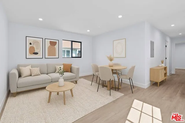 a living room with furniture and a table