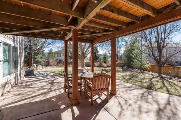a view of a porch with wooden floors
