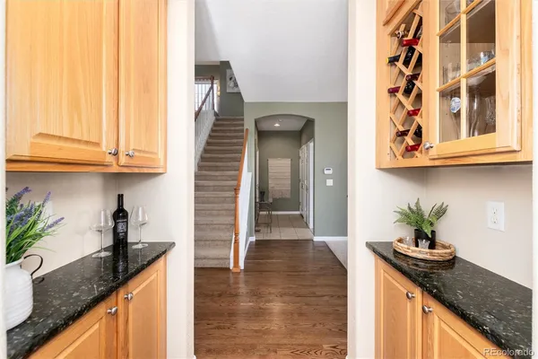 a kitchen with stainless steel appliances granite countertop a sink a stove and cabinets