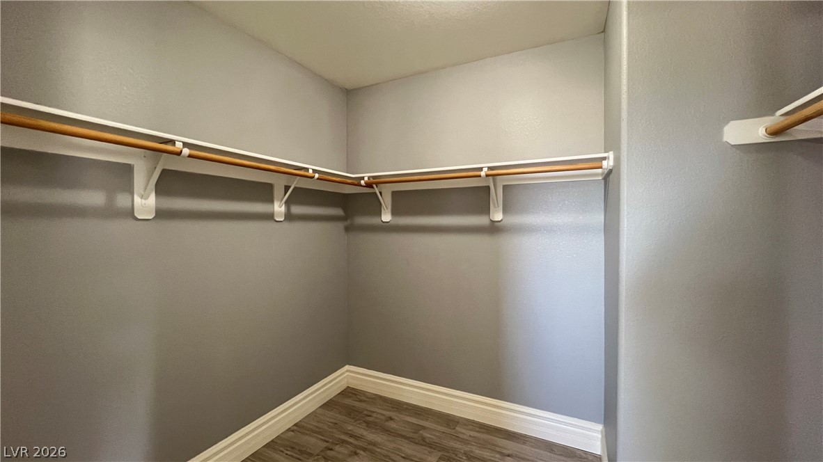 258 Rustic Club Way Las Vegas, NV 89148 - Photo 16 of 25 An organized closet offers ample storage with convenient hanging rods and shelving.