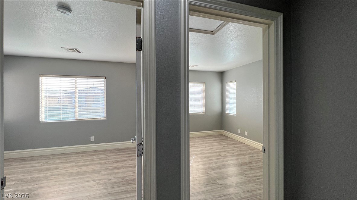 258 Rustic Club Way Las Vegas, NV 89148 - Photo 17 of 25 These two inviting rooms offer a serene canvas for your personal touches.