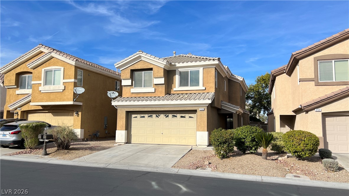 258 Rustic Club Way Las Vegas, NV 89148 - Photo 2 of 25 This charming residence features a classic tile roof and an attached garage.