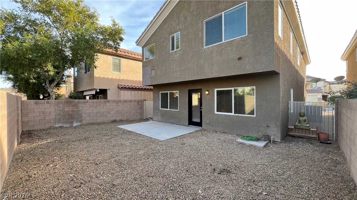 258 Rustic Club Way Las Vegas, NV 89148 - Photo 23 of 25 This outdoor space offers privacy with block fencing and a concrete patio.