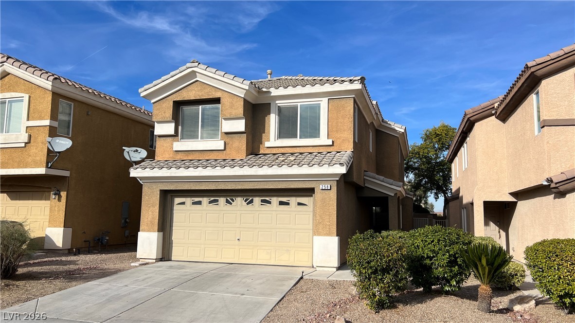 258 Rustic Club Way Las Vegas, NV 89148 - Photo 3 of 25 This residence showcases a clean stucco exterior with an attached garage.