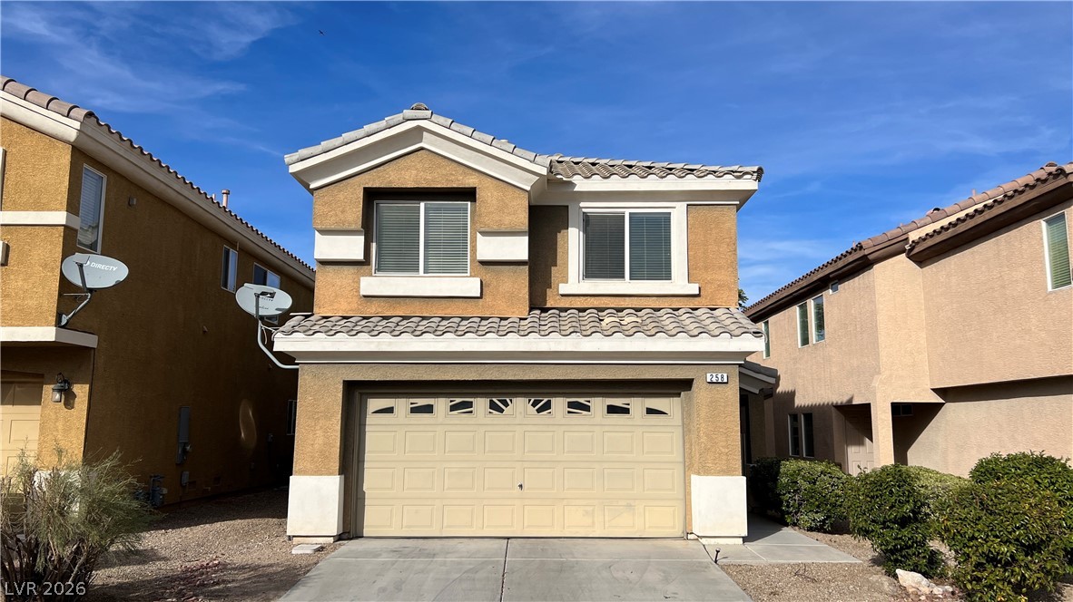 258 Rustic Club Way Las Vegas, NV 89148 - Photo 4 of 25 This two-story home features a tiled roof and an attached garage with convenient driveway parking.