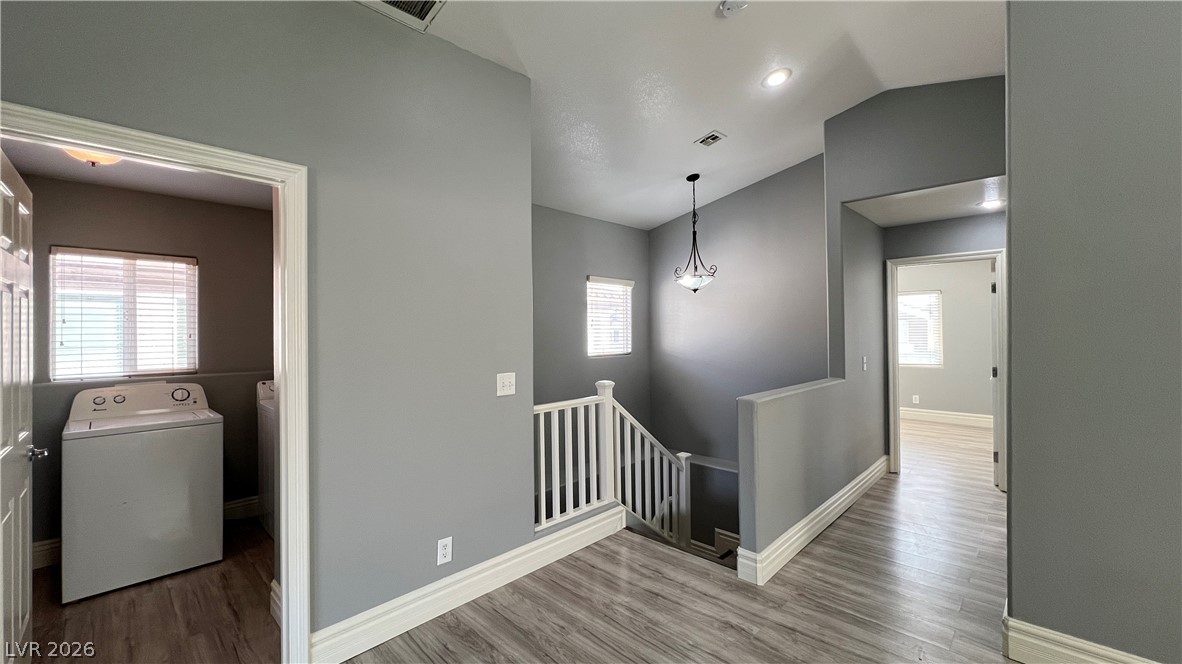 258 Rustic Club Way Las Vegas, NV 89148 - Photo 9 of 25 This spacious laundry room offers convenience and functionality within a well-maintained interior.