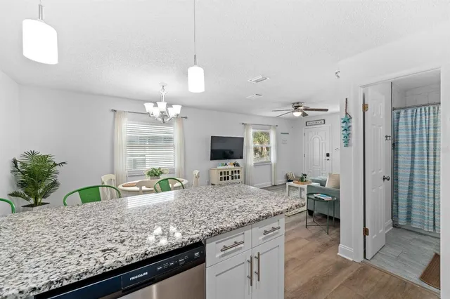 a view of living room with granite countertop furniture and fireplace