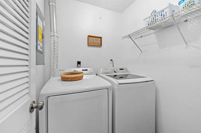 a utility room with dryer and washer