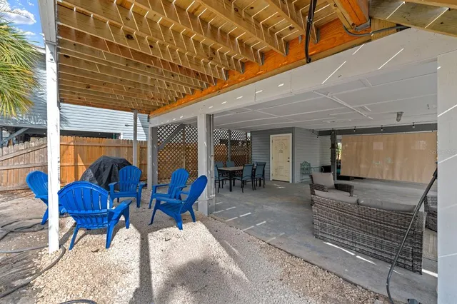 a view of a dinning table and chairs in the patio