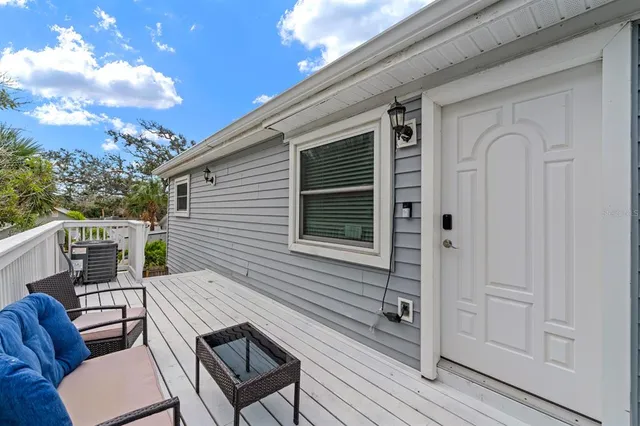 a view of a balcony with furniture