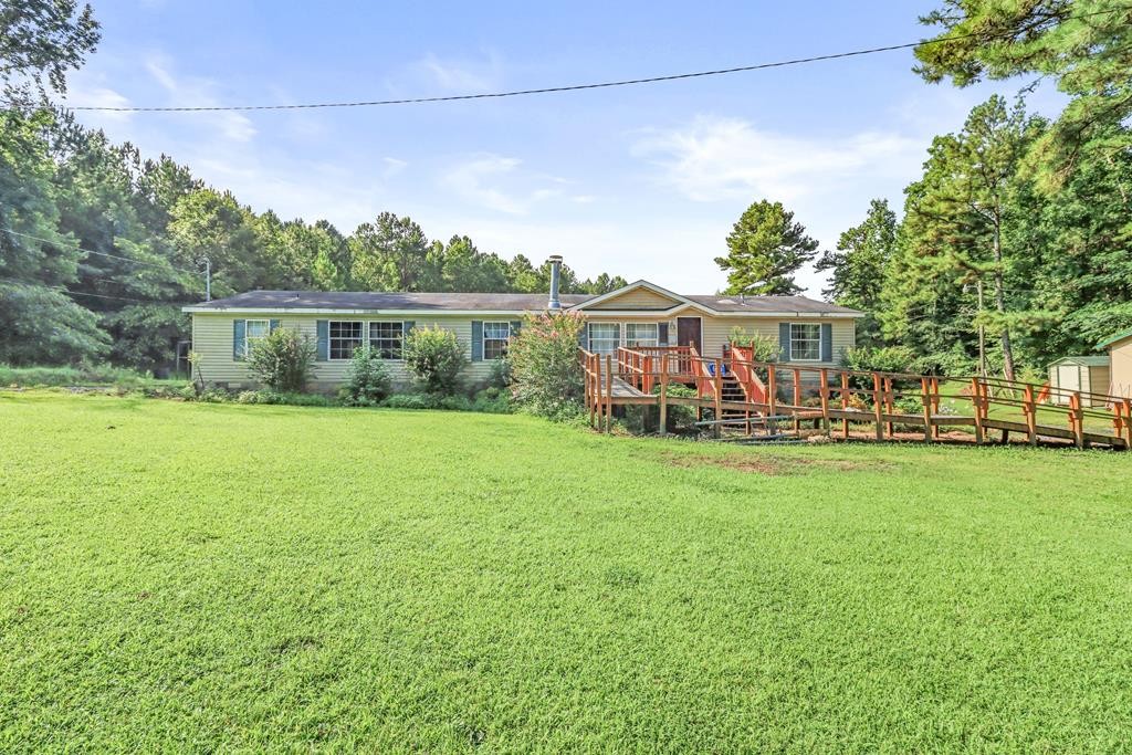 2676 South Riverbend Road Dalton, GA 30721 - Photo 1 of 28 a view of a house with a big yard