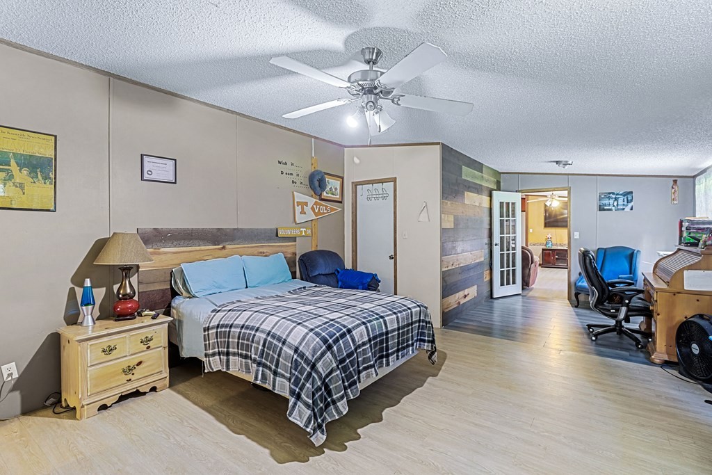 2676 South Riverbend Road Dalton, GA 30721 - Photo 17 of 28 a bedroom with a bed and furniture