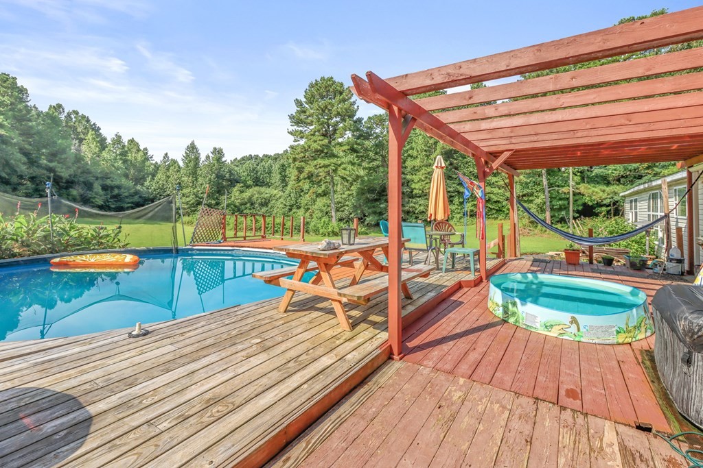 2676 South Riverbend Road Dalton, GA 30721 - Photo 27 of 28 a view of swimming pool with a back yard